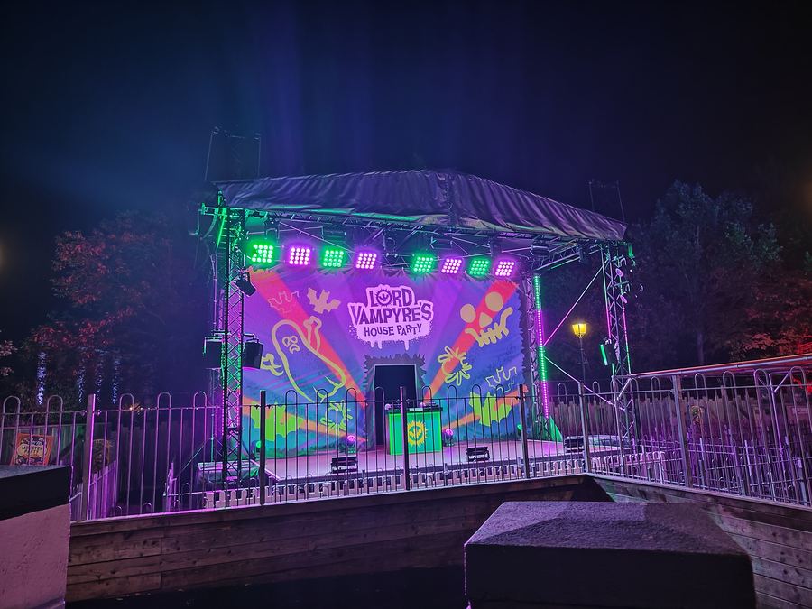 Themed outdoor stage with colourful lighting